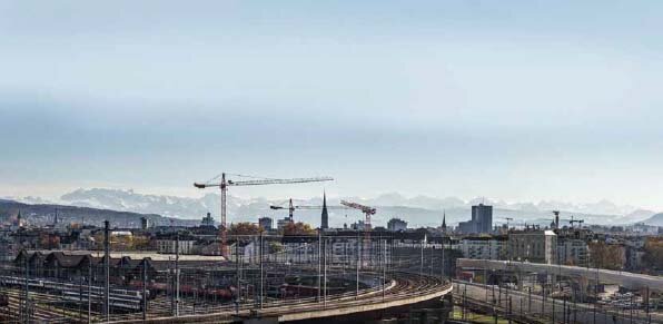 Tower Cranes A Landscape view of some tower cranes around a city