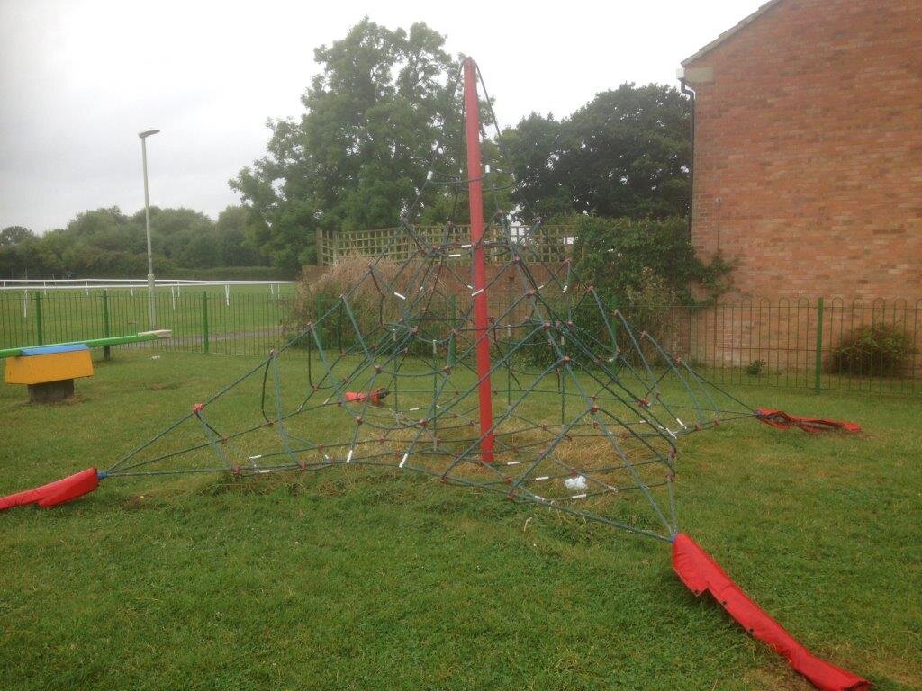 Damaged playground space net before replacement at Hardwicke Village Park Gloucestershire