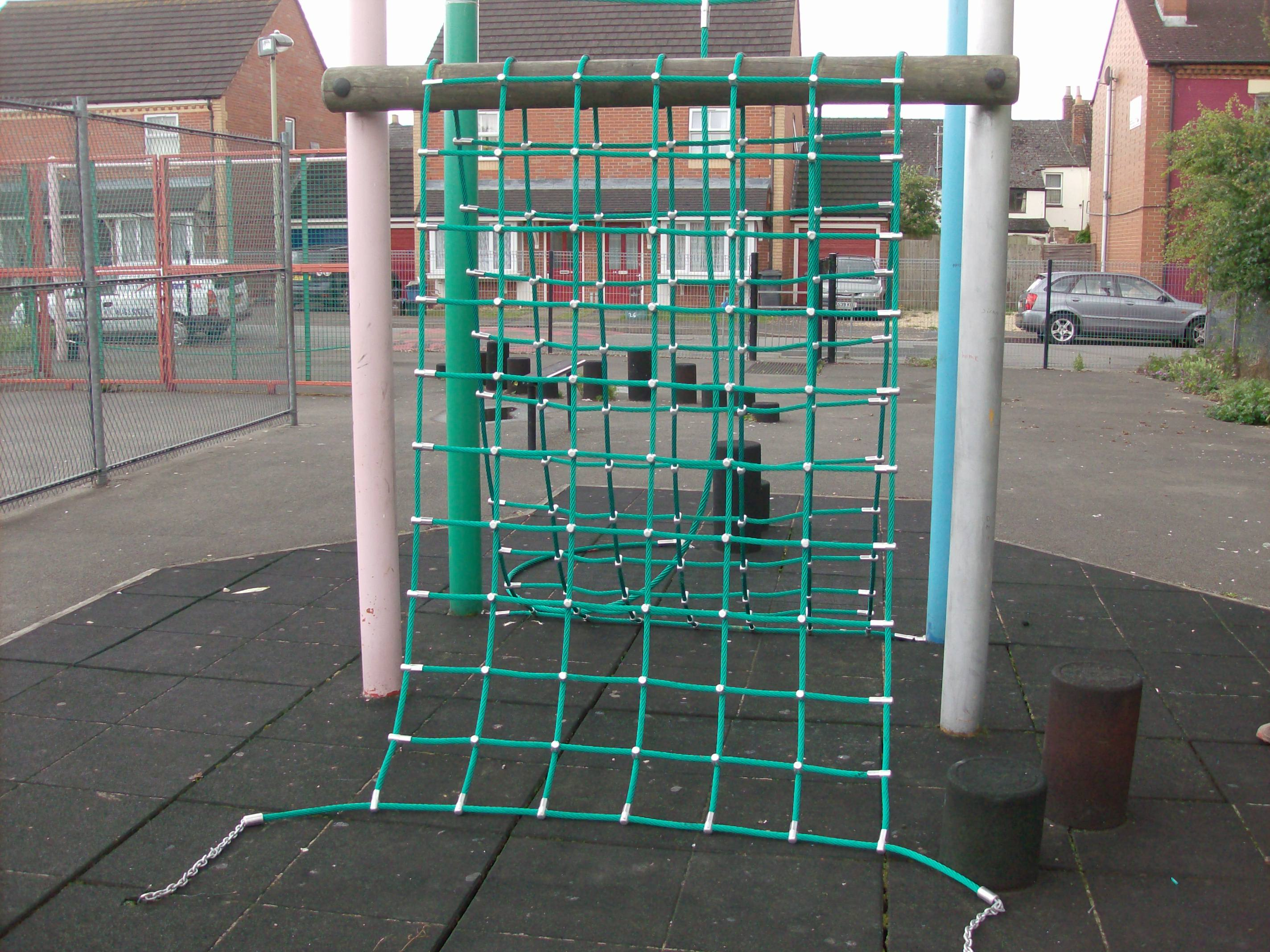 Children’s playground climbing net installed in park setting