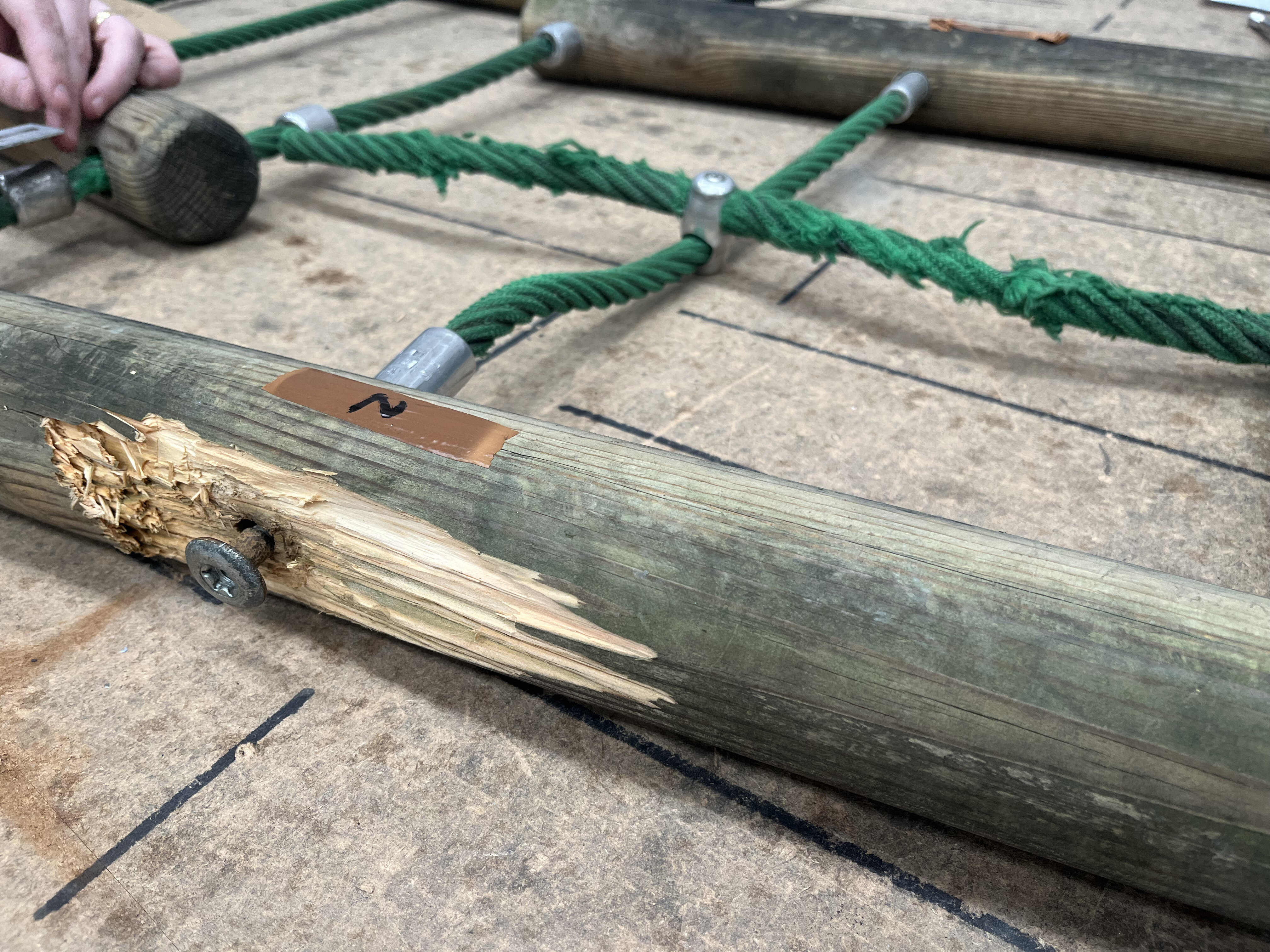 Damaged playground rope bridge