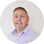 profile photo of a mans head with a purple shirt 