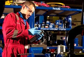 An engineer inspecting a lifting component