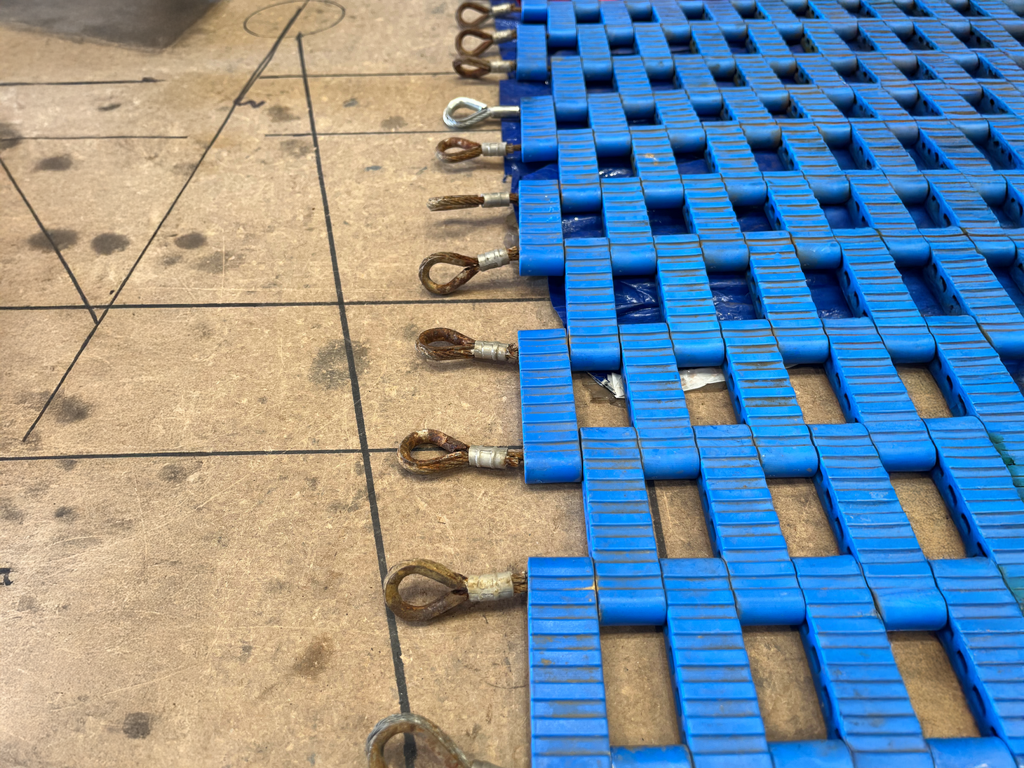 Playground Floor Trampoline Repair Certex UK Repaired playground floor trampoline with replaced worn structural wires - before